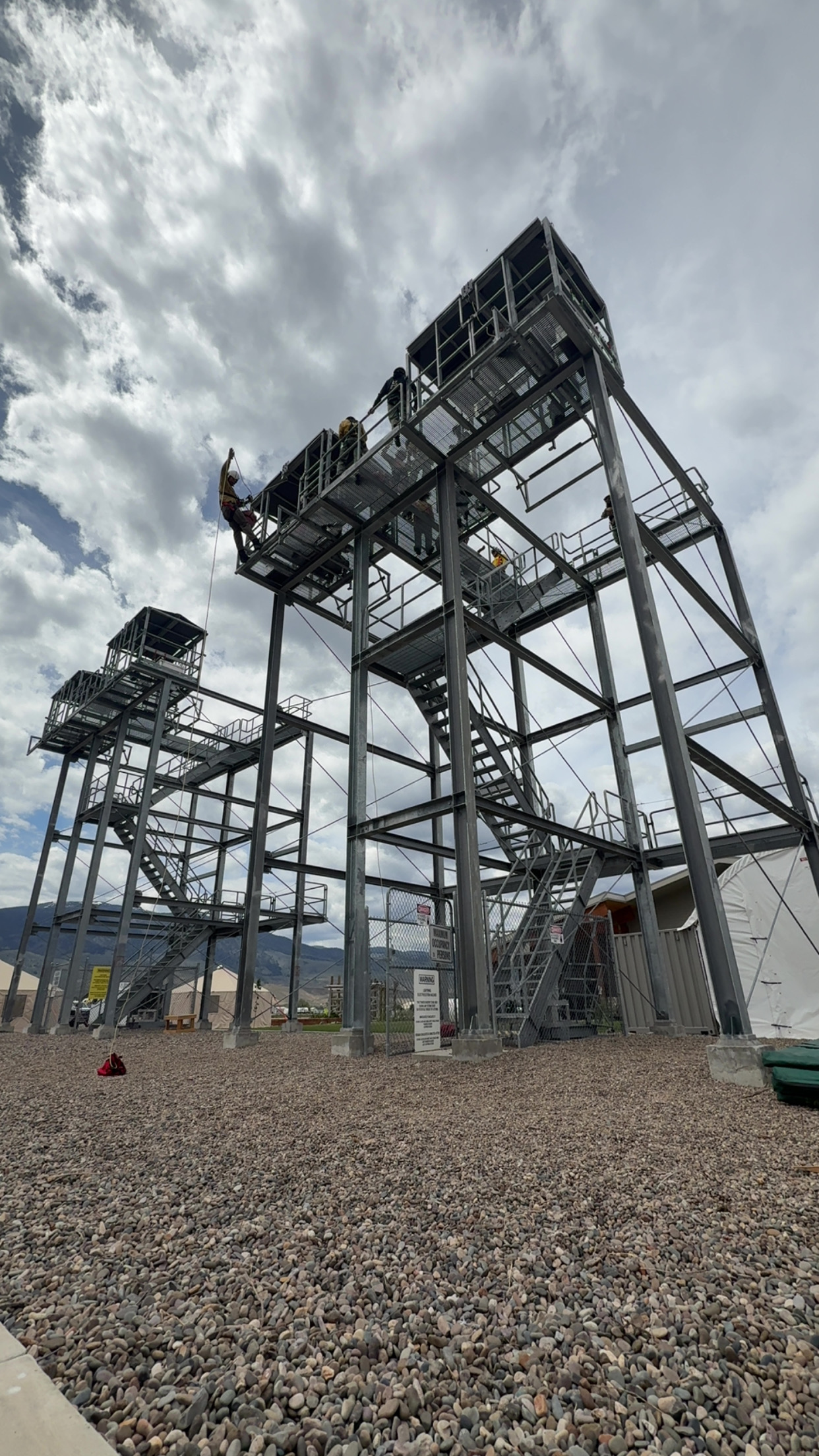 North Idaho Rappellers rookies train on the rappel towers at the National Rappel Academy in Salmon, Idaho, preparing for helicopter rappel operations.