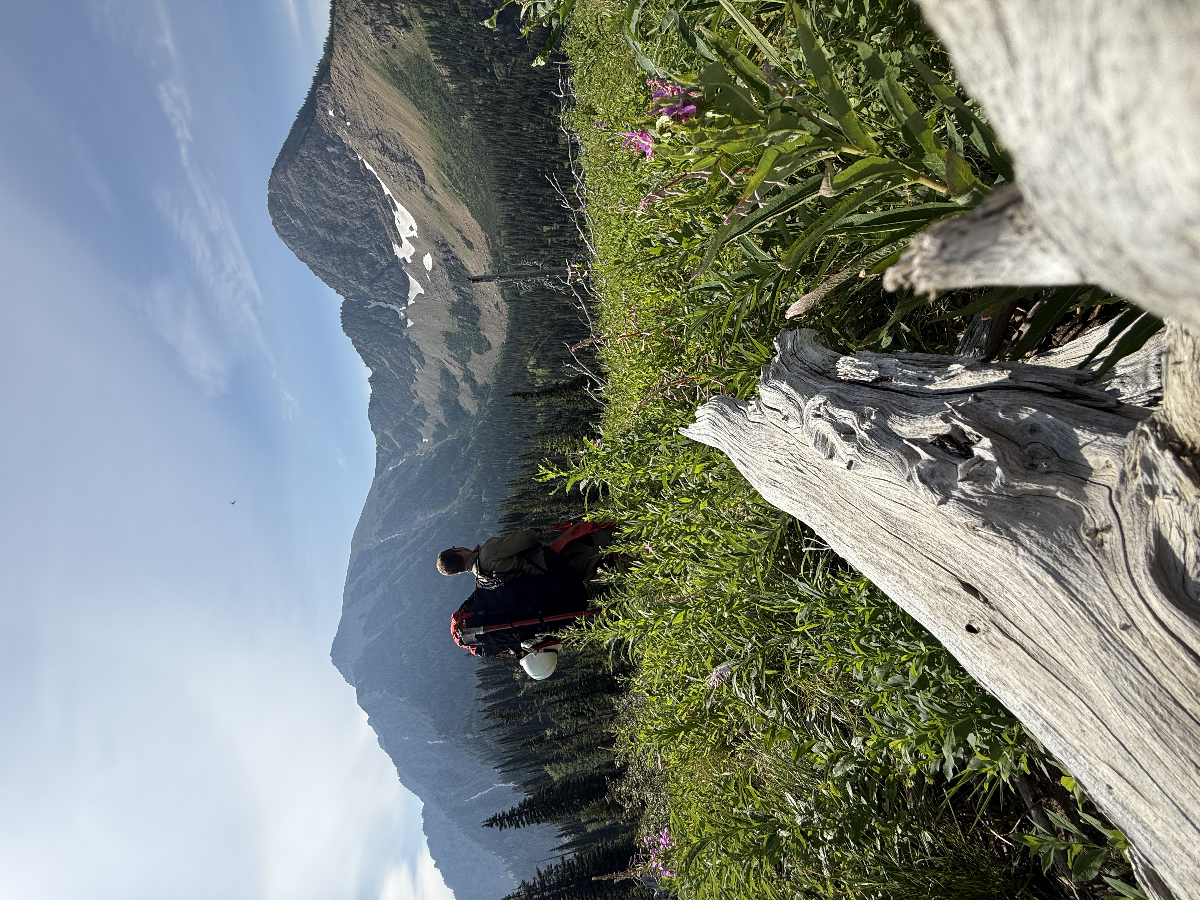 North Idaho heli-rappellers carry specialized packout gear through remote mountain terrain while supporting wildland fire initial attack operations in the Northern Rockies.
